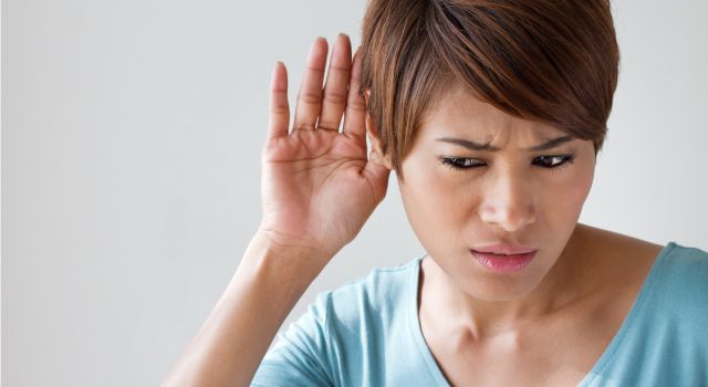 woman struggling to hear