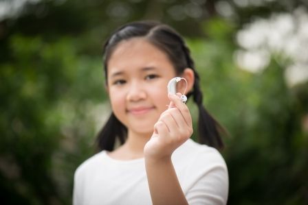 Pediatric hearing aids have come a long way. Unobtrusive