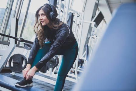 woman ready to get on the treadmill at the gym