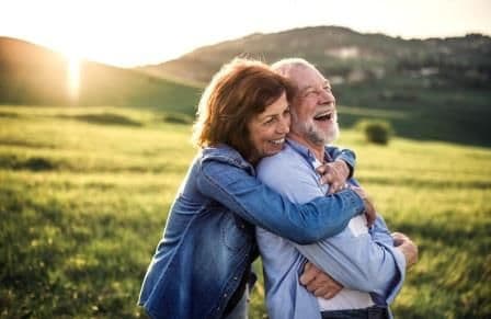 mature couple in an embrace at dawn