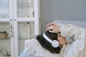 woman resting with headphones on