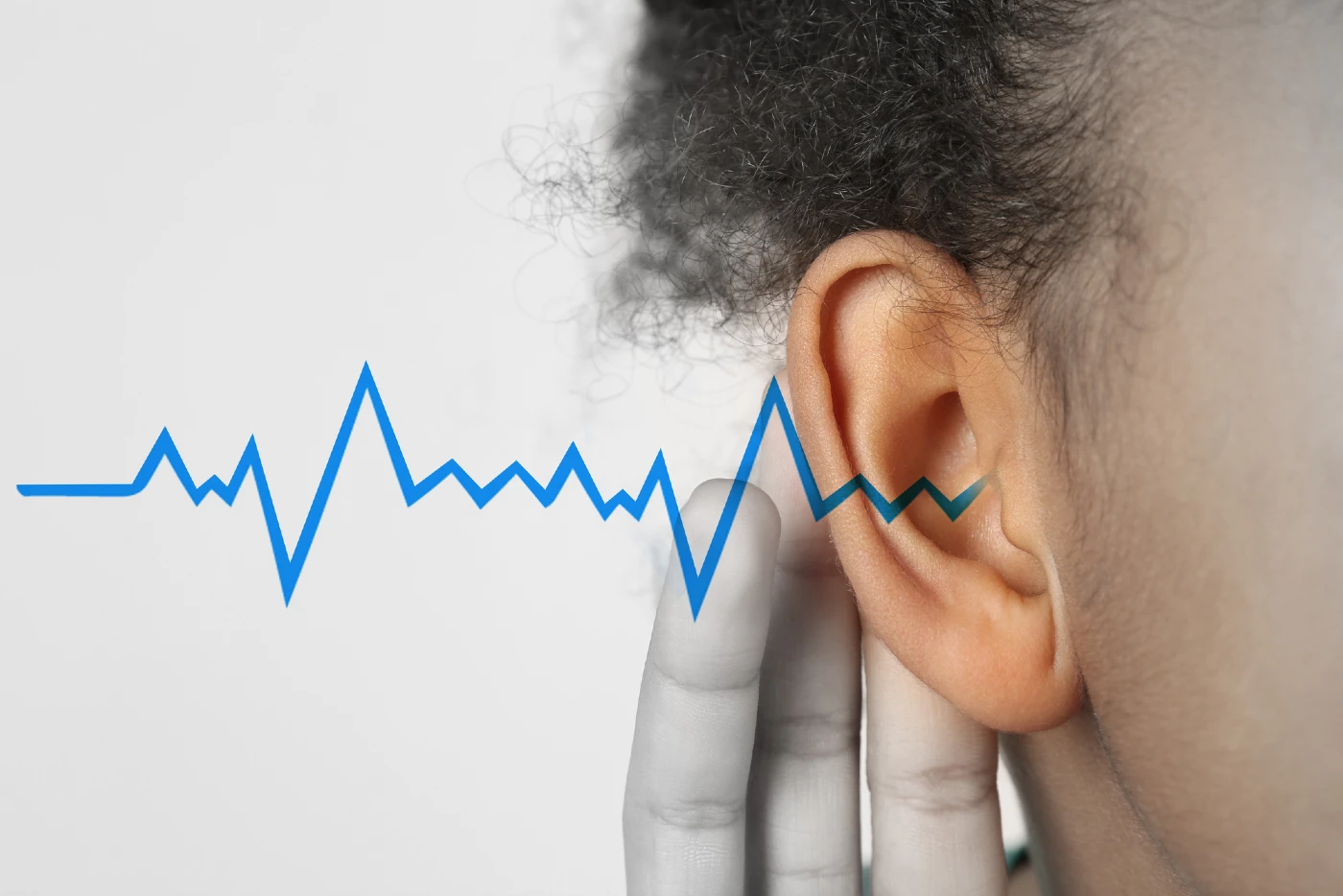 Close up to a person’s ear with drawing sound waves coming out of their ear.