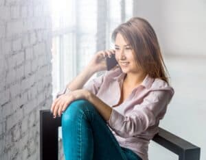 A young woman is talking on her mobile phone.