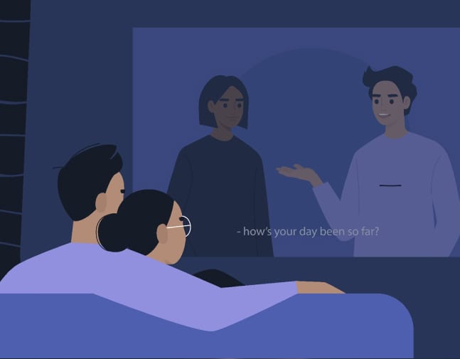 A couple watching a show with subtitles.