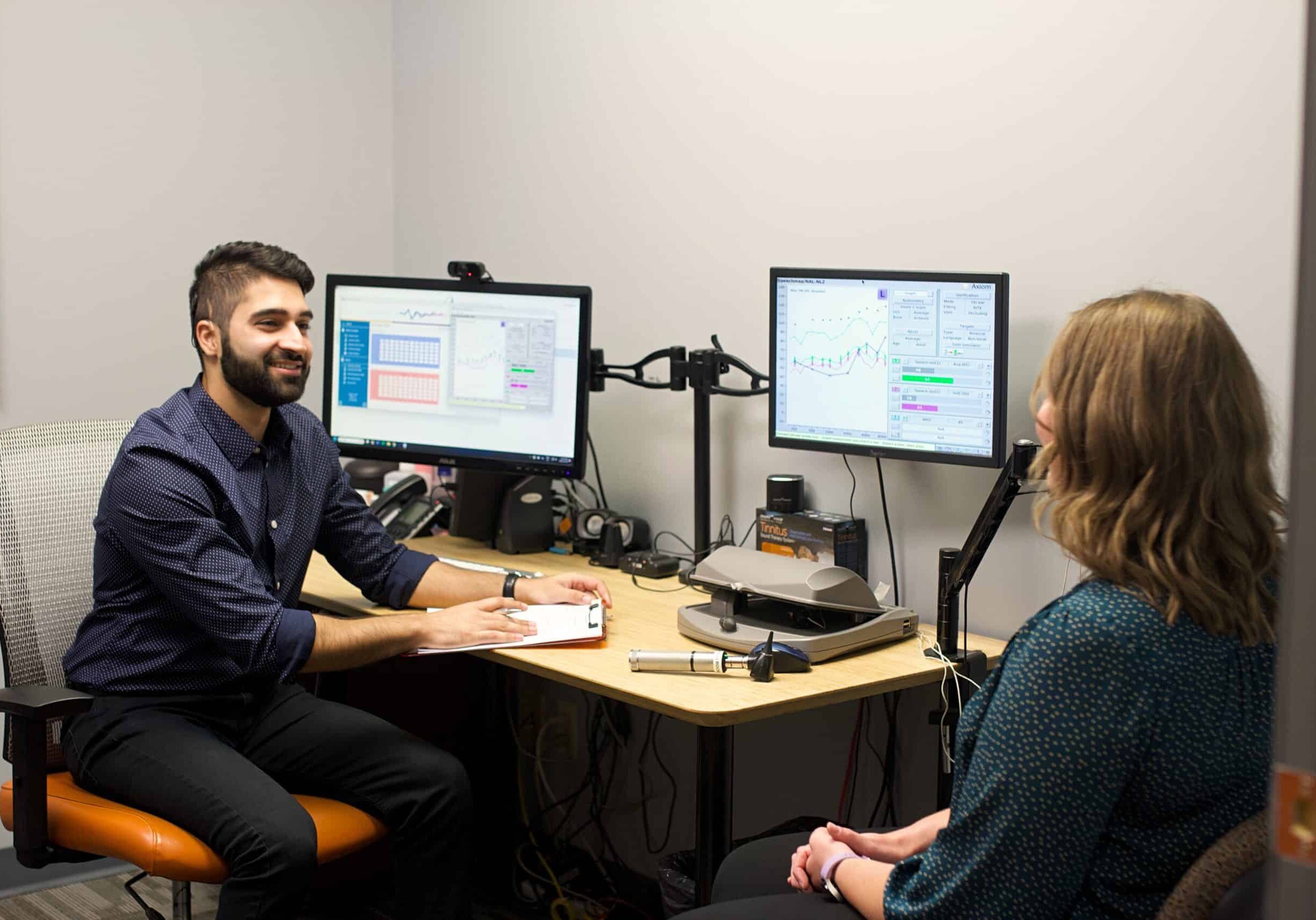Audiologist talking with the patient
